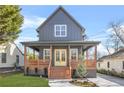 Charming two-story home features a welcoming front porch, manicured lawn, and a modern gray exterior at 3378 Bachelor St, Atlanta, GA 30344