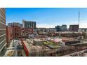 Aerial view of community rooftop with city views, featuring a playground and ample green space at 650 Glen Iris Drive Ne # 27, Atlanta, GA 30308
