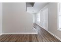 Bright living room with wood-look flooring and neutral paint color at 7623 Mcgillicuty Dr, Union City, GA 30291