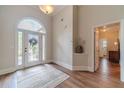 Welcoming foyer with hardwood floors and arched doorway at 1657 Williams Mill Way, Dacula, GA 30019