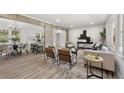 Bright, open-concept living room featuring a seamless flow into dining area, with hardwood floors and neutral tones at 2376 Cross Nw St, Atlanta, GA 30318