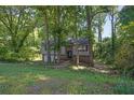 Beautiful two-story home surrounded by lush greenery with a well-maintained lawn and inviting curb appeal at 3189 Glen Hollow Dr, Rex, GA 30273