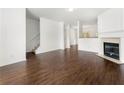 The open living space features dark hardwood floors, fireplace, and ample natural light at 6750 Blackstone Pl # 6, Mableton, GA 30126