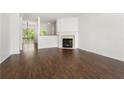 Spacious living room boasts hardwood floors, fireplace, and natural light at 6750 Blackstone Pl # 6, Mableton, GA 30126