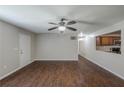 Open-concept living room with wood-look flooring and view into kitchen area at 1808 Arkose Se Dr, Atlanta, GA 30316