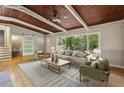 Spacious living room with hardwood floors, large window, and comfortable furnishings at 3539 Eaglerock Dr, Doraville, GA 30340