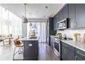 Gourmet kitchen boasting stainless steel appliances, stone countertops, and dark cabinets at 399 Pratt Se Dr # 910, Atlanta, GA 30315