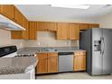 Functional kitchen featuring stainless steel appliances, durable countertops, and ample cabinet space for storage at 6359 Wedgeview Dr, Tucker, GA 30084