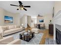 Cozy living room with stylish furnishings, ceiling fans, and a fireplace feature creating an inviting atmosphere at 6359 Wedgeview Dr, Tucker, GA 30084