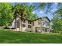 Charming two-story home with a spacious yard, showcasing a blend of classic and modern architectural elements at 3425 Poplar Dr, Lawrenceville, GA 30044