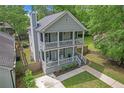Charming home featuring a double porch, well-maintained exterior, and lush landscaping at 1039 Fern Se Ave, Atlanta, GA 30315