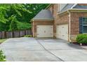 Attached two-car garage with convenient driveway access at 225 Sundance Dr, Woodstock, GA 30188