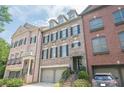 Welcoming townhome entrance with manicured landscaping at 2295 Falmouth Se Ct, Smyrna, GA 30080