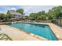 Outdoor pool with lounge chairs and umbrellas, great for relaxation and entertainment at 4135 Creekwood Dr, Cumming, GA 30041