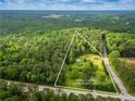 Aerial view of a 10.08 acre lot with approx lot lines, house, trees and greenery at 4380 Highway 138, Oxford, GA 30054