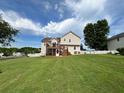 Expansive backyard with lush green grass, mature trees, and a white picket fence at 19 Magnolia Ne Ct, Rydal, GA 30171