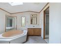 Bathroom with a large soaking tub, vanity, and separate shower at 4934 Pickys Se Holw, Acworth, GA 30102
