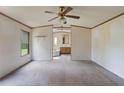 Spacious bedroom featuring an en-suite bathroom and ceiling fan at 4934 Pickys Se Holw, Acworth, GA 30102