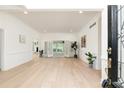 Bright living room with hardwood floors and view to sun room through shuttered French doors at 823 Laurel Crest Sw Ct, Marietta, GA 30064