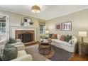 Inviting living room with a cozy fireplace, stylish seating, and elegant decor for comfortable gatherings at 95 Brandon Ridge Dr, Atlanta, GA 30328