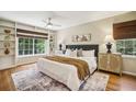 Serene main bedroom featuring built-in shelves, hardwood floors, and ample natural light at 95 Brandon Ridge Dr, Atlanta, GA 30328