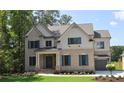Beautiful two-story brick home boasts professional landscaping and attached garage at 333 Mont Harmony Sw Rd, Powder Springs, GA 30127