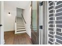Welcoming entryway with staircase and hardwood flooring at 71 Krog Ne St, Atlanta, GA 30307