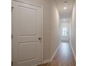 Bright hallway with hardwood floors leads to an inviting entryway at 123 Matson Sw Run, Mableton, GA 30126
