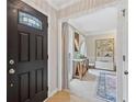 Welcoming foyer with wood floors, an ornate front door, and a glimpse into the brightly lit living spaces at 2166 Carlyle Dr, Marietta, GA 30062