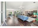 Open concept living space with hardwood floors, and combined kitchen and dining area at 755 Waterbrook Ter, Roswell, GA 30076