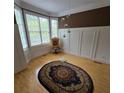 Bright living room with hardwood floors, large windows, and elegant decorative accents, perfect for relaxation and entertaining at 1042 Emory Parc Pl, Decatur, GA 30033