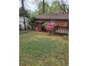 Backyard area with a deck and storage shed at 2137 Plantation Ln, Chamblee, GA 30341
