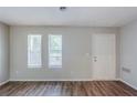 The spacious living room boasts new wood flooring and is bathed in natural light at 2347 Fairway Sw Cir, Atlanta, GA 30331
