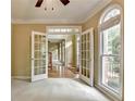 Bright living space featuring French doors, neutral carpet, and plenty of natural light, perfect for relaxing or entertaining at 1885 Milfield Cir, Snellville, GA 30078