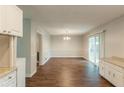 Inviting dining area featuring modern flooring, a stylish chandelier, and sliding glass doors at 2499 Shiloh Dr, Decatur, GA 30034