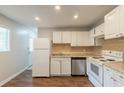 Efficient kitchen featuring white cabinets, stainless steel appliances, and modern finishes at 2499 Shiloh Dr, Decatur, GA 30034