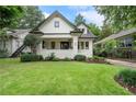 Beautifully landscaped yard and classic bungalow exterior with a freshly cut green lawn at 622 Seminole Ne Ave, Atlanta, GA 30307