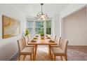Bright dining room features a table set for eight and a large bay window at 742 Redland Dr, Jonesboro, GA 30238