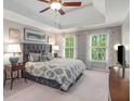 Relaxing main bedroom with trey ceiling, and lots of natural light at 2425 Hamptons Psge, Alpharetta, GA 30005