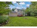 Expansive backyard featuring a red deck perfect for outdoor entertaining at 2584 Shadowbrook Dr, Decatur, GA 30034