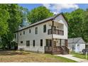 Side view of a two-story home with modern farmhouse design and a small balcony at 515 Cohen St, Atlanta, GA 30310