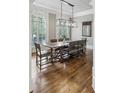 Elegant dining room with hardwood floors, large windows, and contemporary lighting at 604 Timm Valley Ne Rd # A, Atlanta, GA 30305