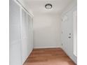 Inviting foyer with wood-look floors, a closet, and a glass-paneled front door for natural light at 24 Dunwoody Springs Dr, Atlanta, GA 30328