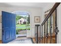 Bright foyer with hardwood floors, stairway, and open view of the front yard at 680 Parkside Trl, Marietta, GA 30064