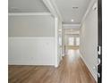 Bright entryway featuring hardwood floors, white trim, and neutral paint, leading into the home's living spaces at 4477 Bethany Manor Dr, Snellville, GA 30039