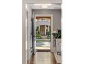 Inviting foyer with hardwood floors and a view of the front porch through the open front door at 970 N Ormewood Park Se Dr, Atlanta, GA 30316