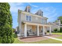 Two-story home with inviting front porch and landscaped front yard, nestled in a quiet neighborhood at 2770 Nautical Way, Villa Rica, GA 30180