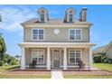 Charming two-story home with a welcoming front porch and well-manicured lawn at 2770 Nautical Way, Villa Rica, GA 30180