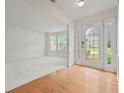 Inviting foyer with a decorative glass front door and gleaming hardwood floors at 6330 Shell Sw Dr, Atlanta, GA 30331
