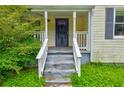 Inviting covered front porch with classic details and entry door at 246 Stafford Nw St, Atlanta, GA 30314